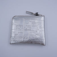 COMME des GARCONS - EMBOSSED LOGOTYPE(SILVER)
